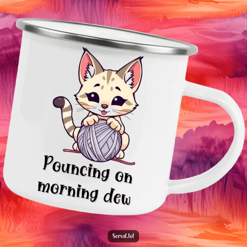 Funny serval camping mug, a wild cat playfully pouncing on a ball of yarn, ideal for outdoor fun.