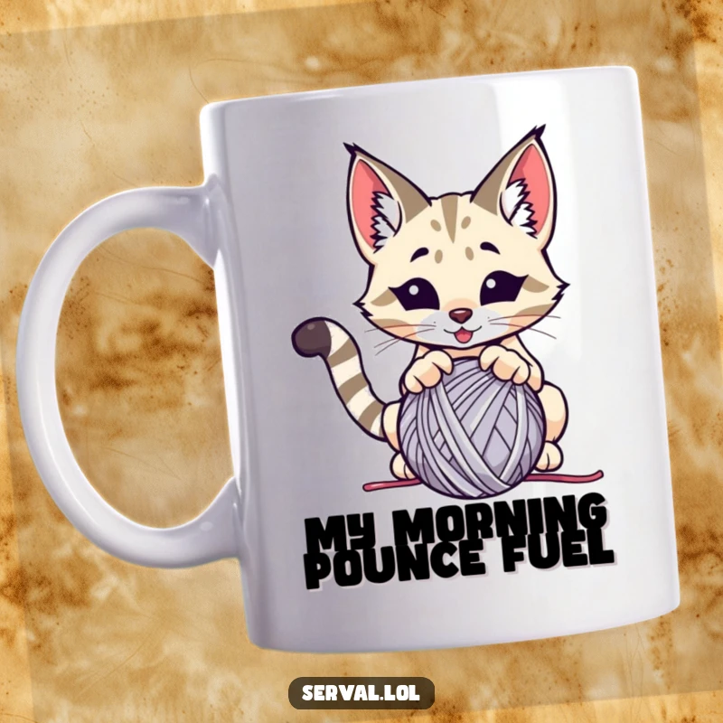 Funny serval mug, a wild cat playfully pouncing on a ball of yarn, capturing a moment of feline mischief.
