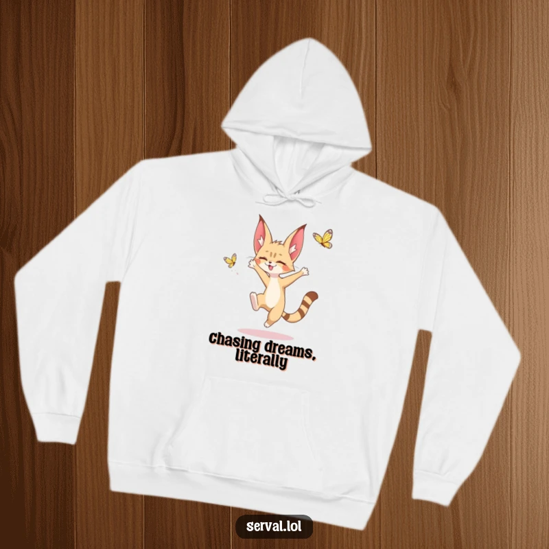 Funny hoodie featuring a kawaii serval character in a dynamic leap, reaching for a butterfly, offering warmth and endearing charm.