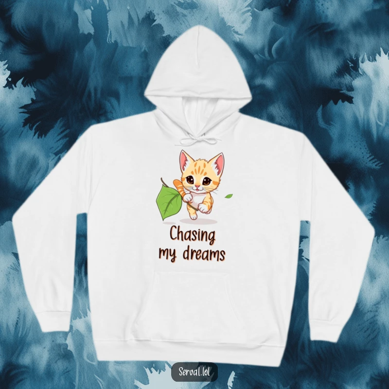Funny Serval Kitten Leaf Chase Hoodie: A cozy hoodie featuring a serval kitten chasing a leaf, offering cute, wild humor.