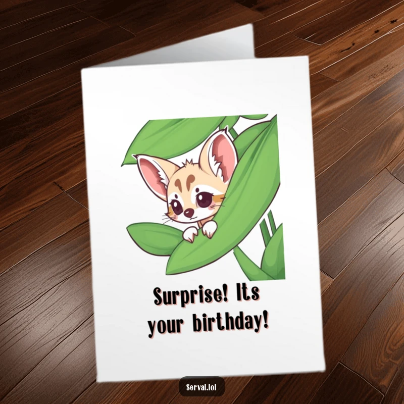 Funny Free Printable Birthday Card: A serval peeking playfully from behind a large, vibrant jungle leaf, full of curiosity.