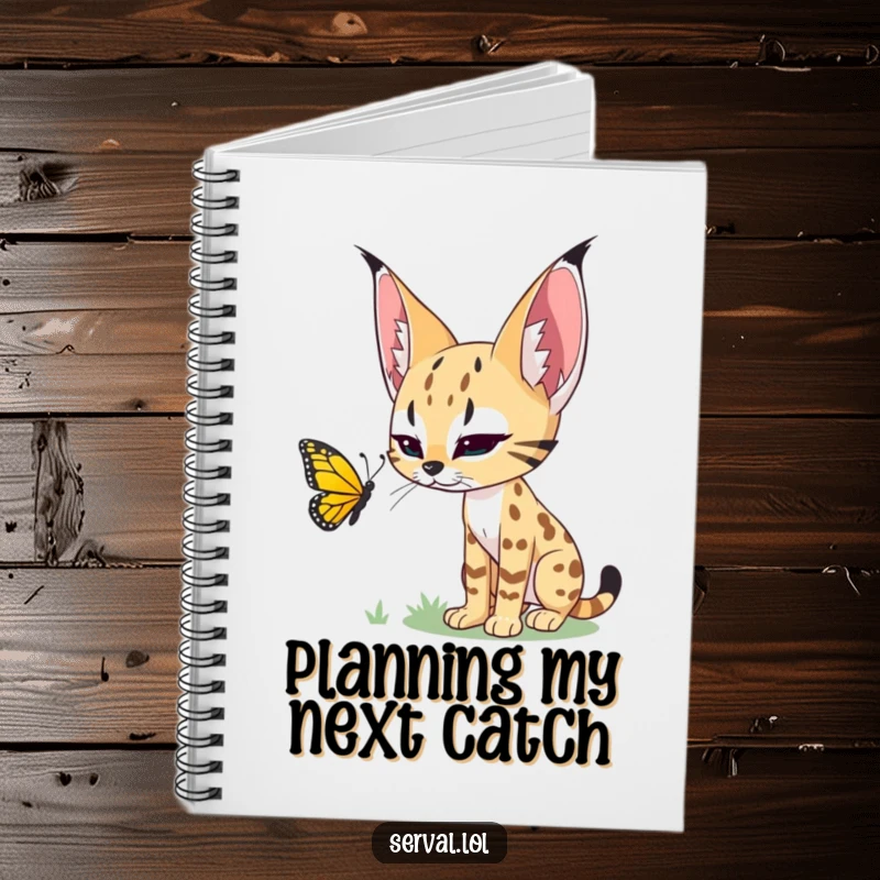 Funny notebook featuring a serval stalking a butterfly, ideal for note-taking with a touch of wild elegance.