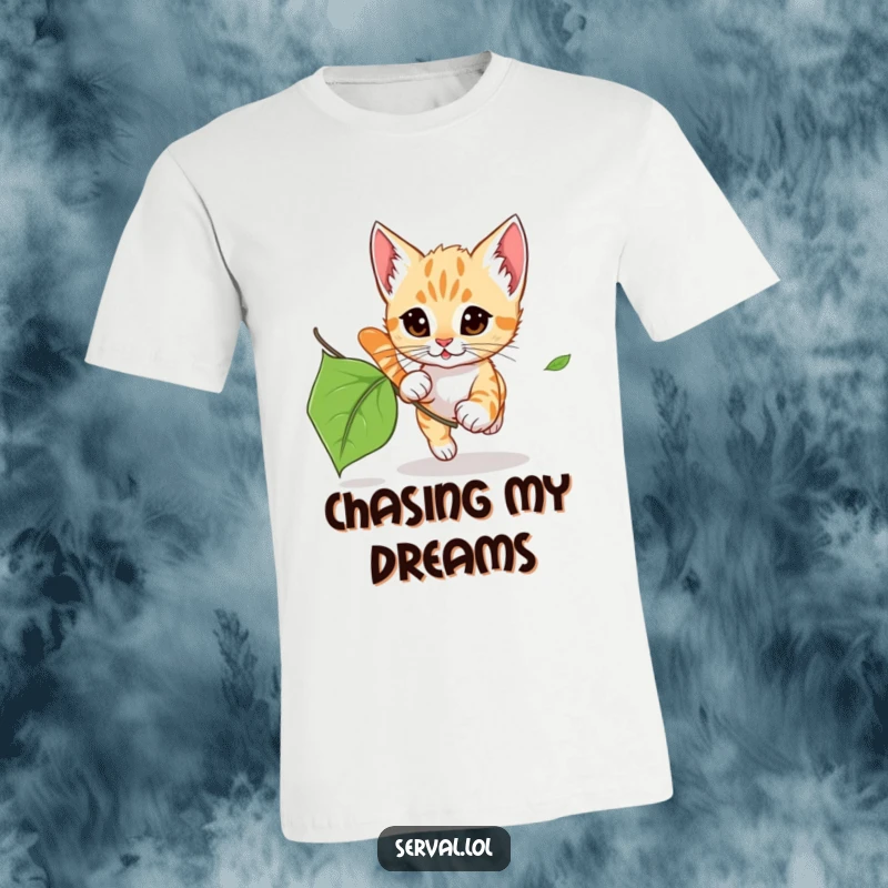 Funny Serval Kitten Leaf Chase T-Shirt: A small serval kitten excitedly pouncing on a dancing, rustling leaf.