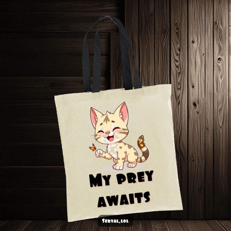 Funny Serval Tote Bag: A happy serval character in a dynamic pounce towards a butterfly, a fun accessory.