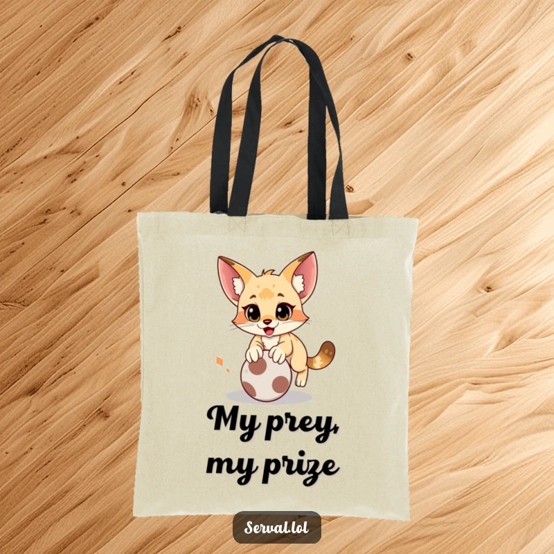 Funny serval tote bag featuring a cat performing a comical pounce on a rolling ball, blending utility with humor.